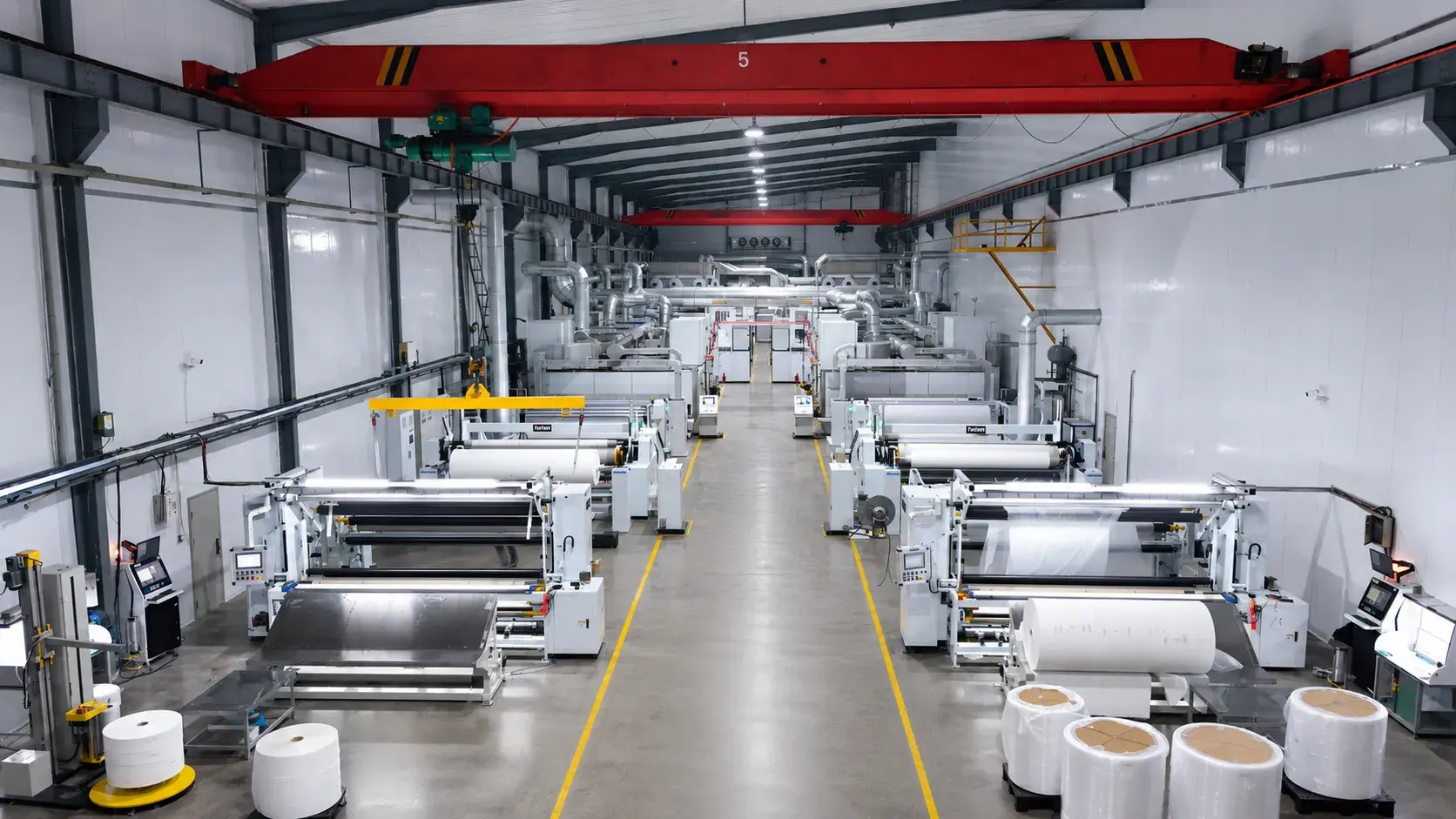 High-capacity automated nonwoven converting and slitting production lines in a modern manufacturing facility - urightmaterials