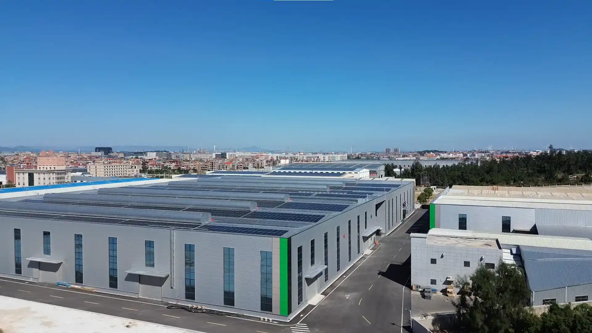 Aerial view of urightmaterials modern solar-powered manufacturing facility for high-capacity hygiene material production